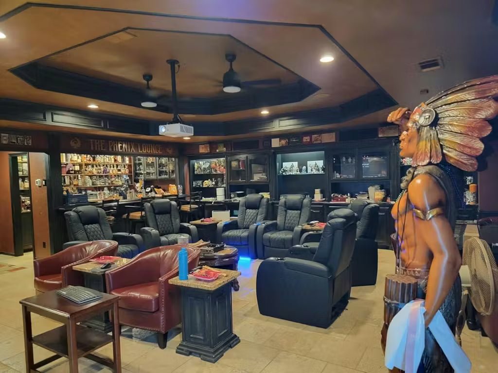 Lounge-style chairs arranged in a home bar setting