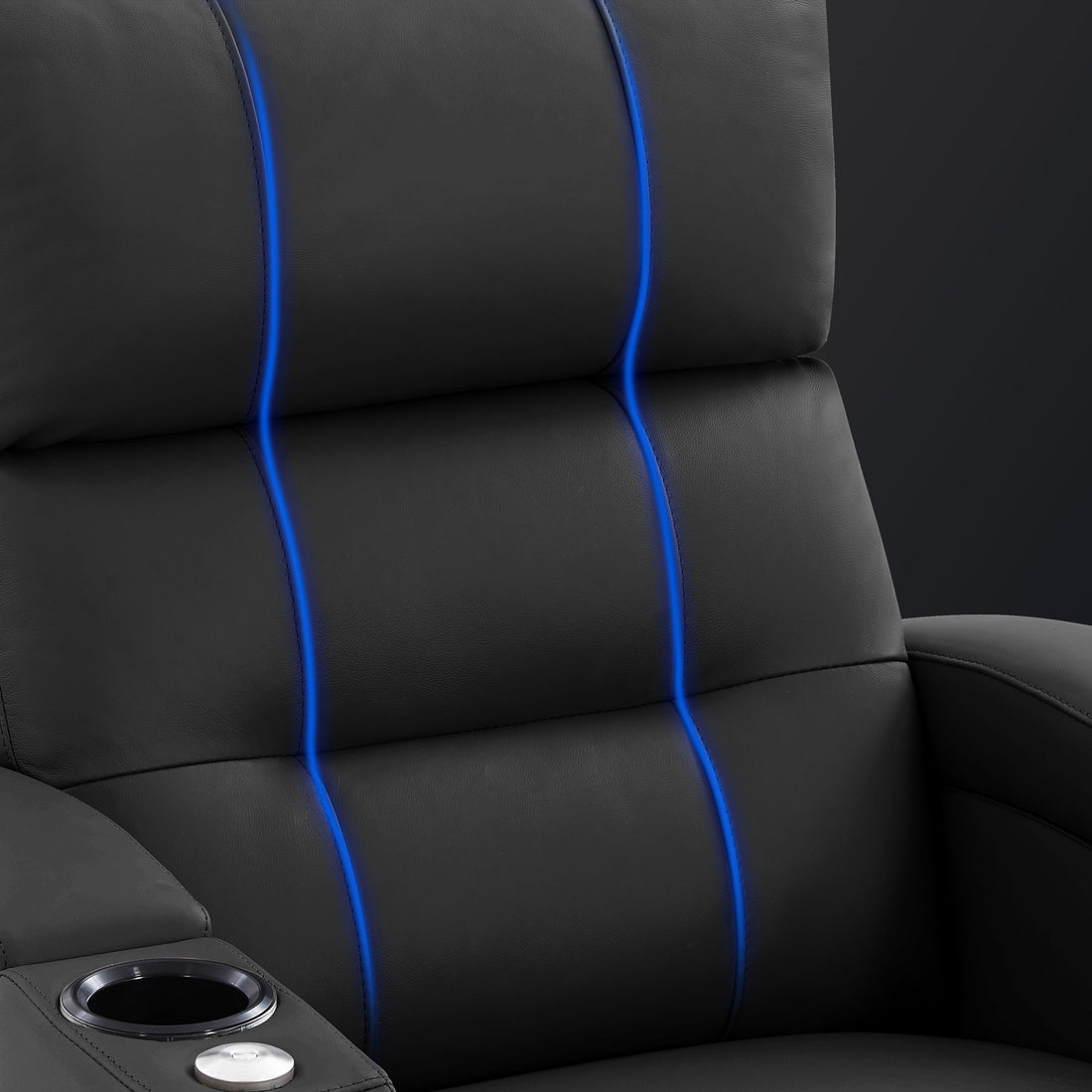 Close-up of the black recliner backrest featuring a streamlined, minimalist design with segmented cushioning.