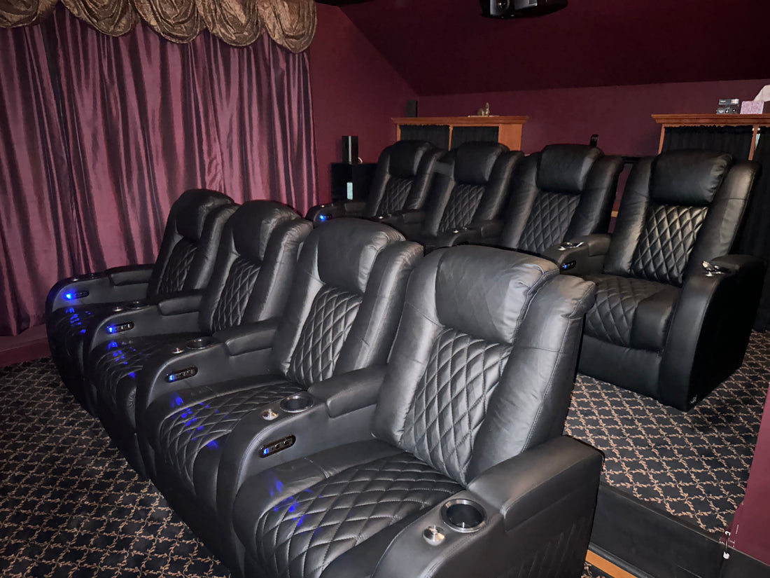 Theater chairs arranged in a dedicated home cinema