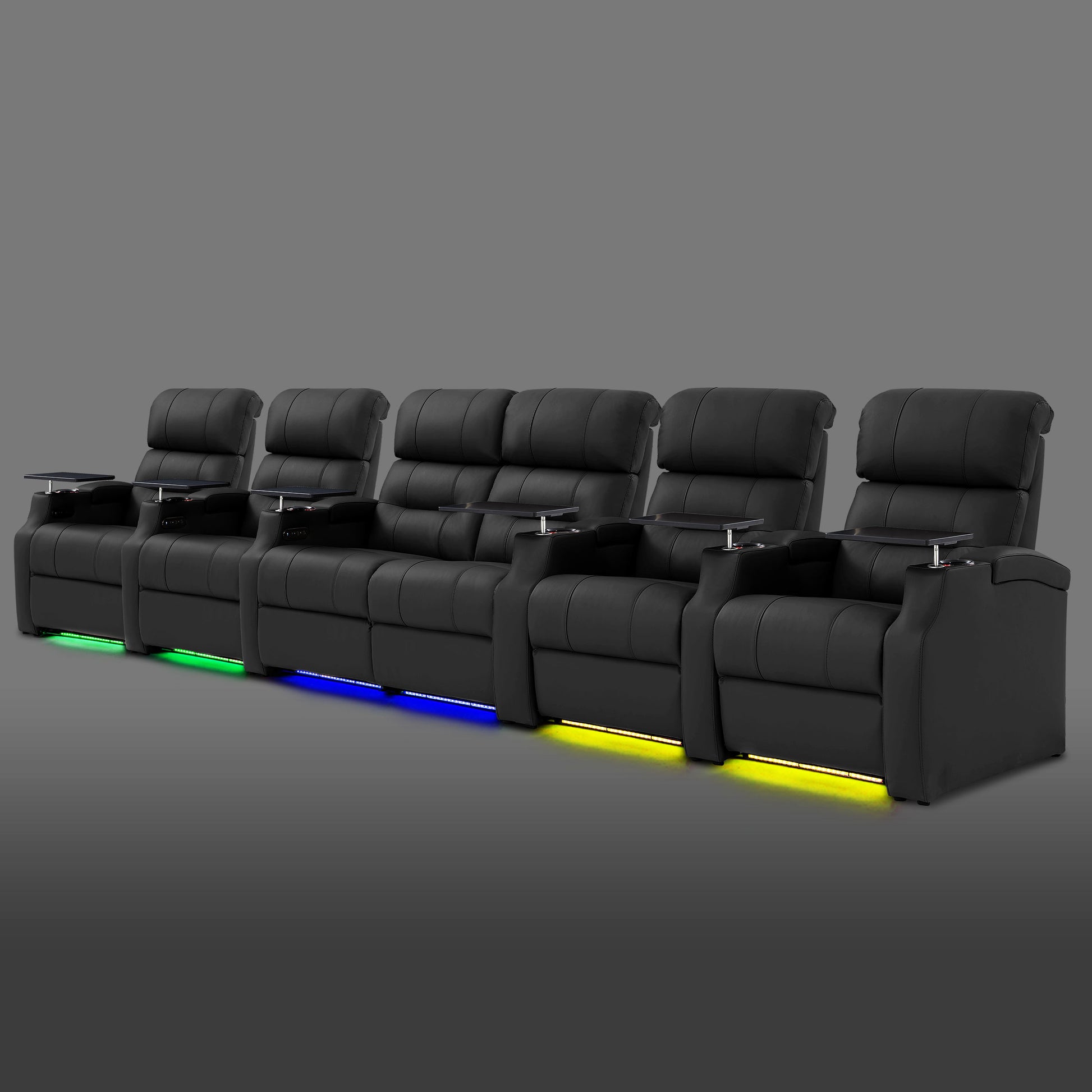 Black 6 seat cinema seating arranged with the middle two recliners together and single seats on both ends
